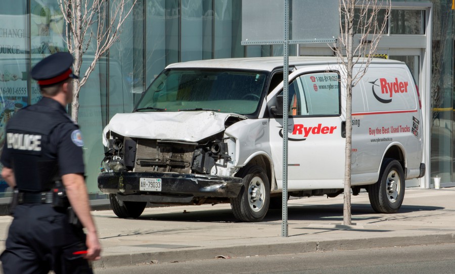(File) A rented van sits on a sidewalk about a mile from where several pedestrians were injured in northern Toronto, Canada, 23 April 2018 (reissued on 03 March 2021). A judge in Toronto in a hearing on 03 March 2021 has convicted the Alek Minassian, the van driver of 10 counts of first-degree murder and 16 counts of attempted murder. Ten people were killed and 16 injured on 23 April 2018, after Alek Minassian driving a rented van mowed down pedestrians along a one-mile stretch of Yonge Street. - EPA/WARREN TODA 