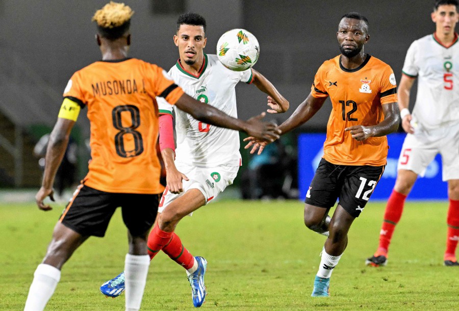 Morocco's midfielder Azzedine Ounahi (C) fights for the ball with Zambia's midfielders Lubambo Musonda (L) and Emmanuel Banda (2R) during the Africa Cup of Nations (CAN) 2024 group F football match between Zambia and Morocco at the Stade Laurent Pokou in San Pedro. - AFP PIC