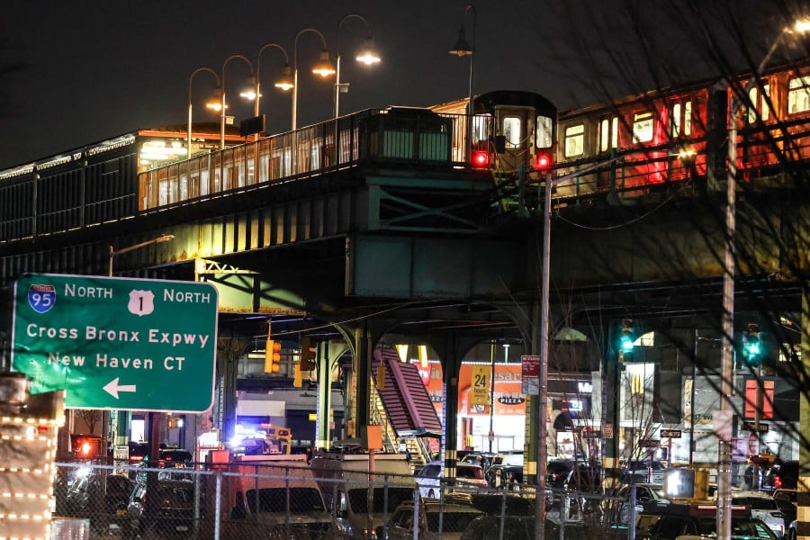 A train stands at the Mt. Eden Avenue subway station in the Bronx borough of New York after the shooting incident at the subway station. - AFP PIC