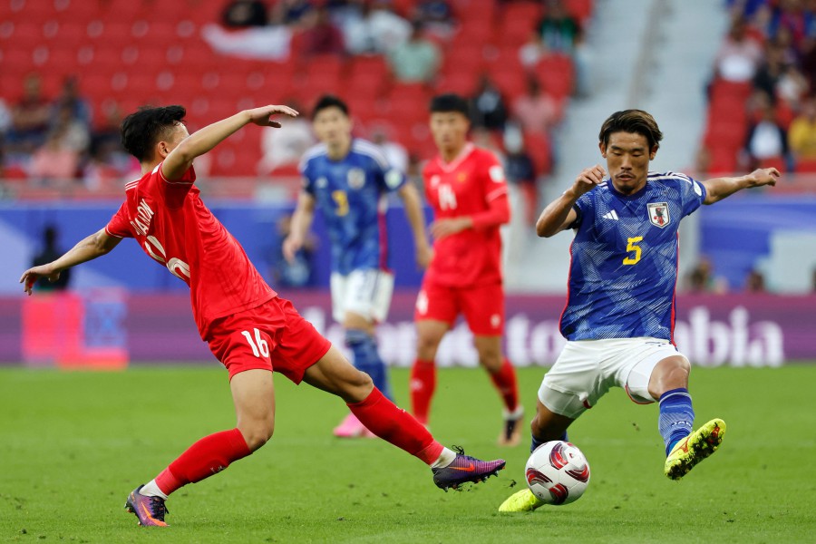 Vietnam's midfielder #16 Nguyen Thai Son fights for the ball with Japan's midfielder #05 Hidemasa Morita during the Qatar 2023 AFC Asian Cup Group D football match between Japan and Vietnam on January 14, 2024. - AFP pic