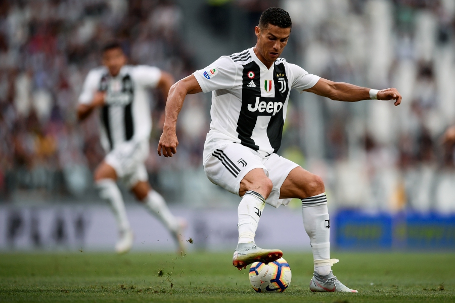 Juventus' Portuguese forward Cristiano Ronaldo controls the ball during the Italian Serie A football match Juventus vs Lazio at the Allianz Stadium in Turin. AFP PHOTO