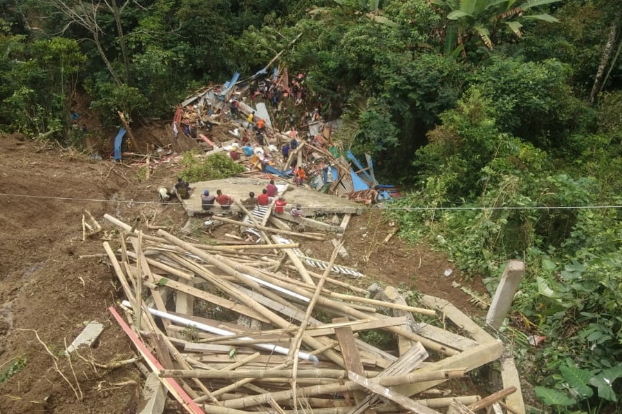 At least 19 people have been found dead and two more are missing after a landslide in central Indonesia, local authorities said on April 14. (Photo by Handout / BASARNAS / AFP)