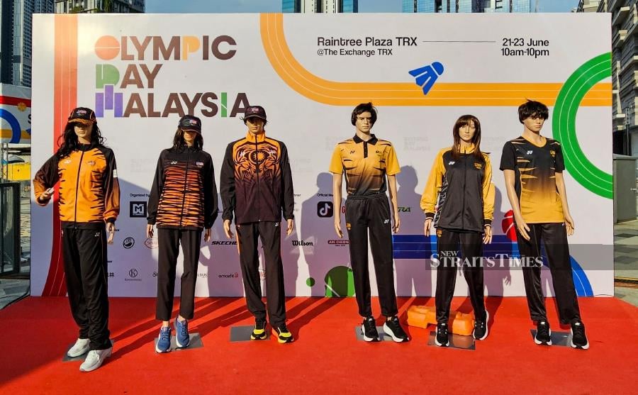 This picture taken on June 23, 2024 shows mannequins displaying the attire for Malaysia's athletes at the Paris 2024 Olympic Games during an event in Kuala Lumpur. Malaysian officials agreed June 28 to redesign some of the country's kit for next month's Paris Games after fans derided the outfits as "ugly" and "cheap looking". AFP PIC 