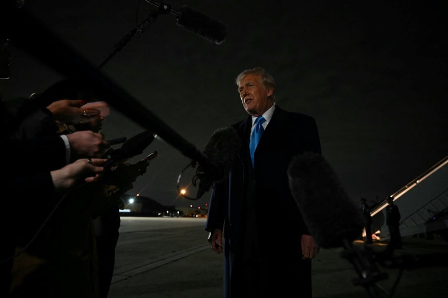 US President Donald Trump speaks to the press upon arrival at Joint Base Andrews in Maryland on February 2, 2025, as he returns to the White House from Florida. - AFP PIC