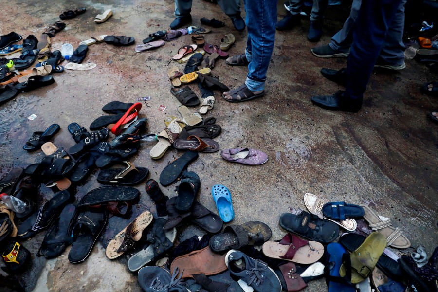 A view of a site with a pile of footwear after a stampede occurred during handout distribution, in Karachi, Pakistan March 31, 2023. -REUTERS PIC