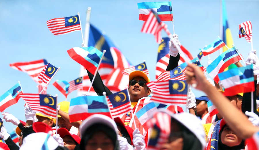 Malaysians celebrate Merdeka on Mt Kinabalu New Straits 