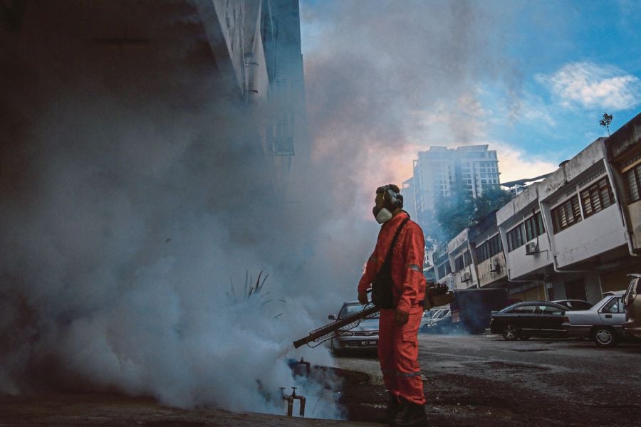 Fogging in Kuala Lumpur in 2020. An expert believes it is not cost effective to run a mass dengue vaccination programme, so it should be prioritised in high-risk urban areas. -FILE PIC