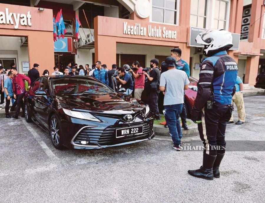 The Toyota Camry used by Prime Minister Datuk Seri Anwar Ibrahim about to leave the PKR headquarters in Petaling Jaya on Monday. -NSTP/SAIFULLIZAN TAMADI