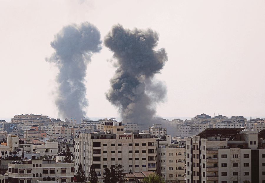 Smoke rises following Israeli strikes in Gaza City on Monday. REUTERS PIC