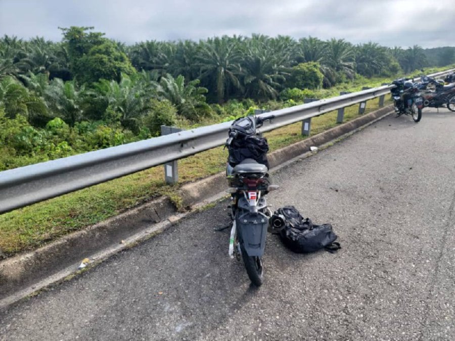 Tragedy struck another RXZ Fighter motorcycle event participant after he was killed when his machine grazed a moving lorry at KM156.9 of the East Coast Expressway near here today. PIC COURTESY OF POLICE