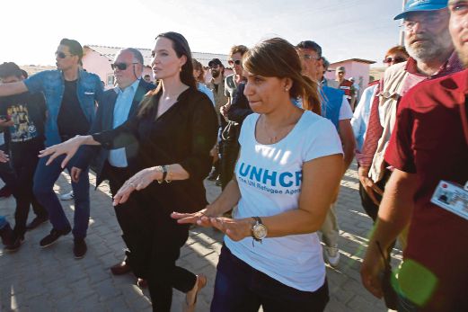 One of the United Nations’ star-studded ‘diplomatic corps’ members, actress Angelina Jolie (left), visiting the Mardin refugee camp in Turkey last month. AFP pic 