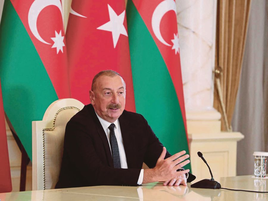 A source says Azerbaijan President Ilham Aliyev is completing something that his father could not do because he ran out of time. AFP PIC/AZERBAIJANI PRESIDENCY/HANDOUT 