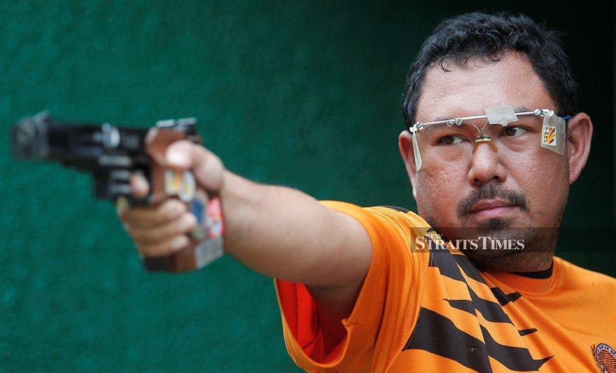 Deputy Sports Commissioner Hasli Izwan Amir Hasan will use his pistol for the last time in the hope of qualifying for his second Olympic outing at the Paris Games. NSTP FILE PIC