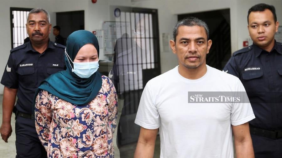 Mayuni Hayeebuding, 48, (Second from right) a Thai national, and his wife, Nor Haznie Che Aziz, 40, made the guilty plea after the charges against them were read out before Magistrate Rais Imran Hamid. — NIK ABDULLAH NIK OMAR
