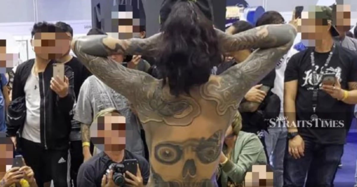 Malaysia orders inquiry over half-naked tattoo show 