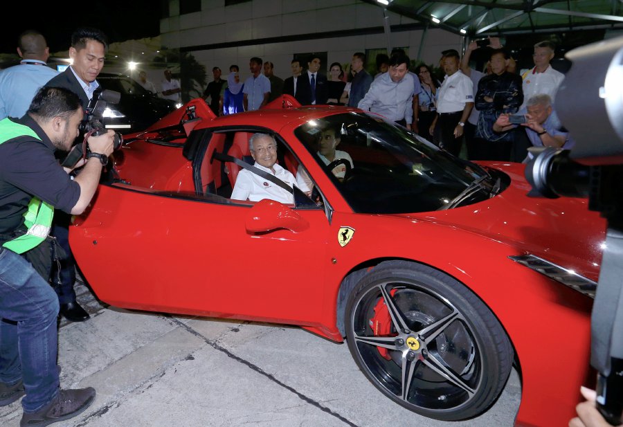Prime Minister Tun Dr Mahathir Mohamad divers a Ferrari after launching the Sepang International Circuit (SIC) lights in Sepang. Pic by AHMAD IRHAM MOHD NOOR