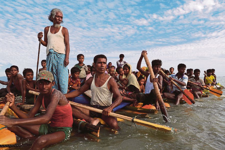 Rohingya refugees crossing the Naf River to reach Bangladesh. REUTERS PIC