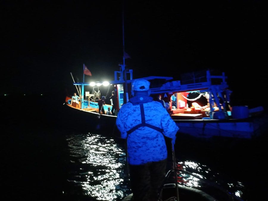 Five local fishermen endured terrifying moments when their boat capsized after being hit by a shoal of whale sharks near Pulau Balar waters here yesterday evening. PIC COURTESY OF MMEA