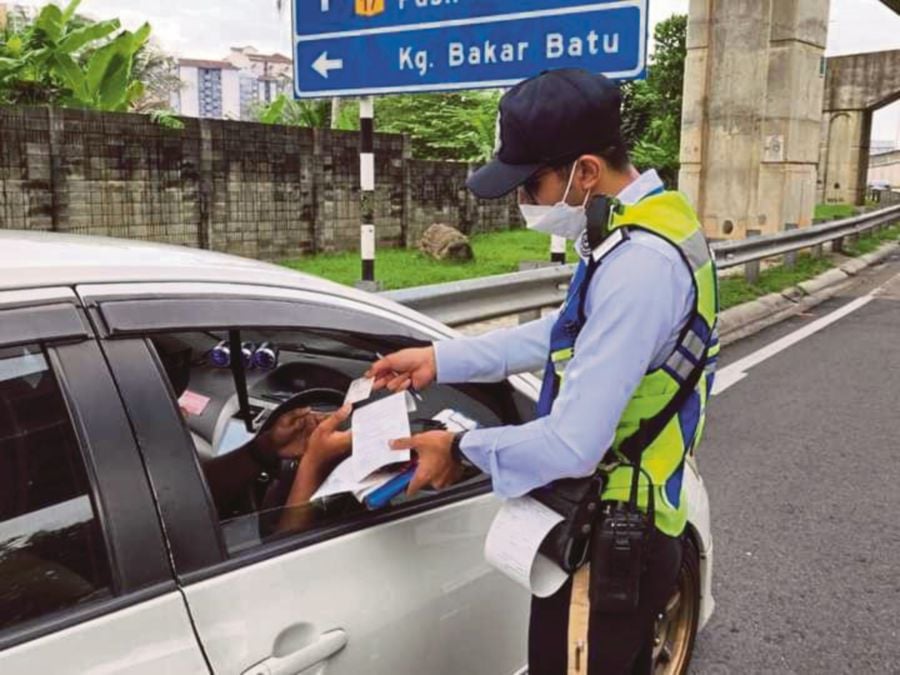The police will offer a 50 per cent reduction for selected compound traffic summons in conjunction with the “One Year With the Madani Government” programme from Dec 8 to 10, at the grounds of the Bukit Jalil National Stadium. COURTESY PIC FOR ILLUSTRATION PURPOSE ONLY
