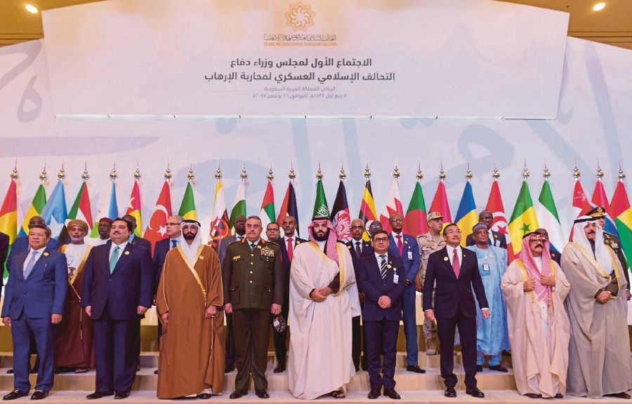 Saudi Crown Prince Mohammed Salman (centre) stands with chiefs of staff and defence ministers of a Saudi-led Islamic military counter-terrorism coalition during their meeting in Riyadh, Saudi Arabia, on Nov 26. REUTERS PIC 