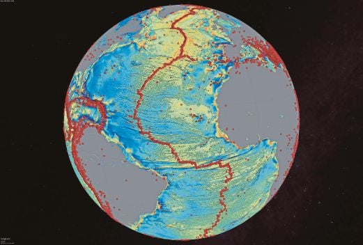 A marine gravity model of the North Atlantic with red dots showing the locations of earthquakes above 5.5 magnitude, highlighting the present-day location of the seafloor, with spreading ridges and transform faults, in this handout image provided by David Sandwell from the Scripps Institution of Oceanography at the University of California (UC) San Diego. Scientists have devised a new map of the Earth's seafloor using satellite data, revealing massive underwater scars and thousands of previously uncharted sea mountains residing in some of the deepest, most remote reaches of the world's oceans.