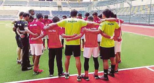Brothers-in-arms time for the national team before the start of training at the National Hockey Stadium in Bukit Jalil yesterday.