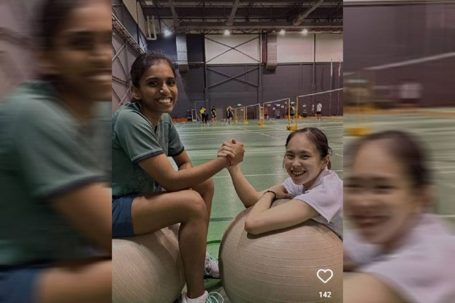 M. Thinaah (left) and Pearly Tan at the Academy Badminton Malaysia in Bukit Kiara on Tuesday. PIC COURTESY OF REXY MAINAKY