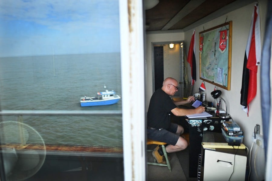 Security guard, Joe Hamill works in the governmental office on the Principality of Sealand, some seven miles (11 kilometres) off the coast of southeast England. -AFP PIC