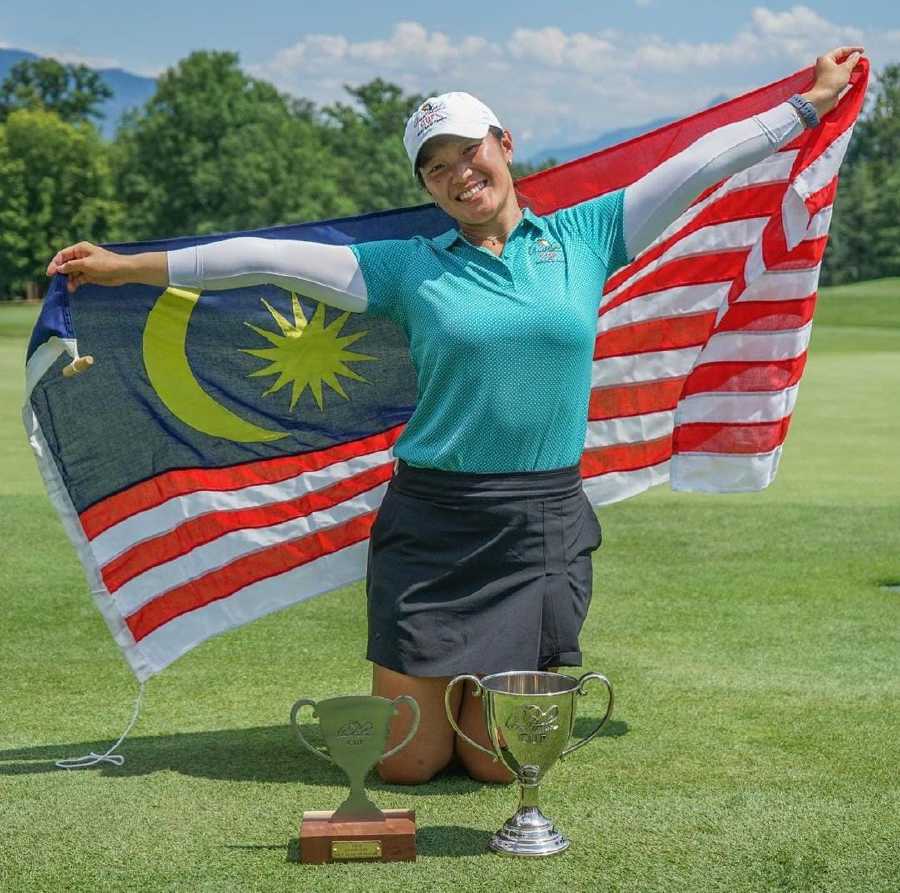 Team International’s Ashley Lau celebrates winning the Arnold Palmer Cup on Sunday.