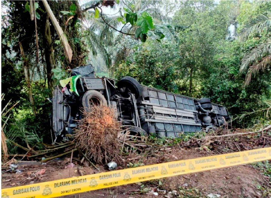 A bus, carrying 39 passengers and two drivers, crashed into the slope of the road after losing control and hitting a trailer carrying a load of iron rod rolls. -- Courtesy pic