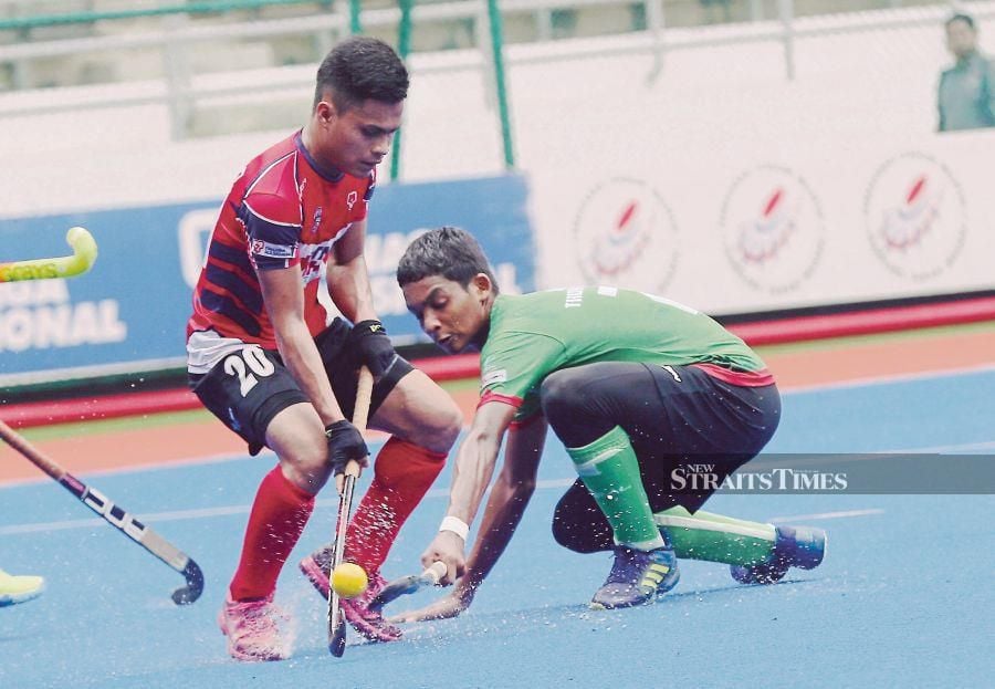 Shafiq Ikhmal Daniel Suzaini (right) is willing to put his body on the line for Malaysia during penalty corners in the Junior World Cup which begins tomorrow at the National Hockey Stadium. NSTP FILE PIC