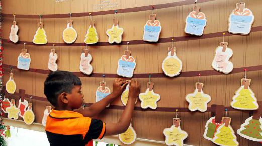 Thirty children of Rumah Ozanam have their hopes pinned on the Wish Board at Taman Desa Medical Centre. Pic by Saifullizan Tamadi. 