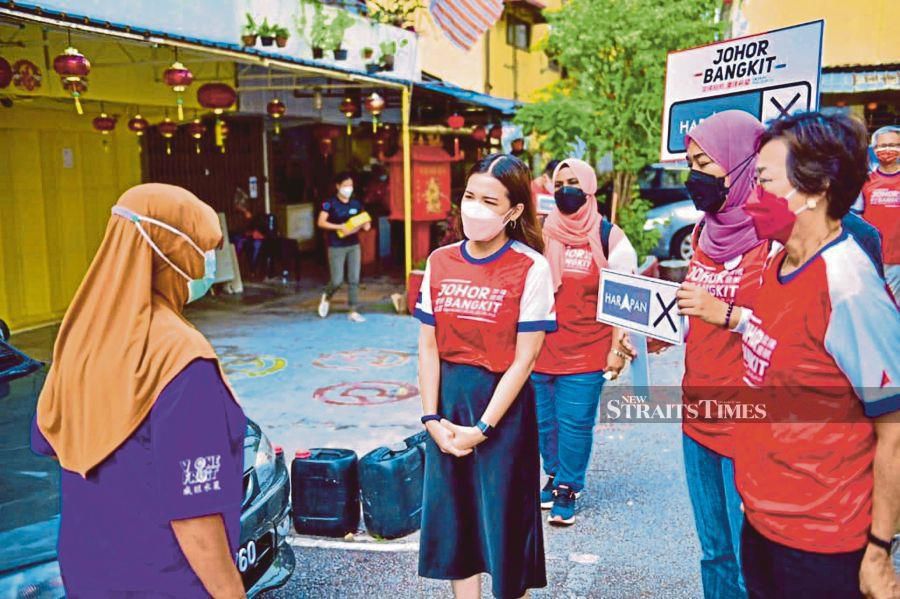 The DAP candidate for the Skudai state seat, Marina Ibrahim, on a  walkabout in the constituency. - NSTP file pic