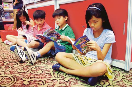 Youngsters engrossed in reading.