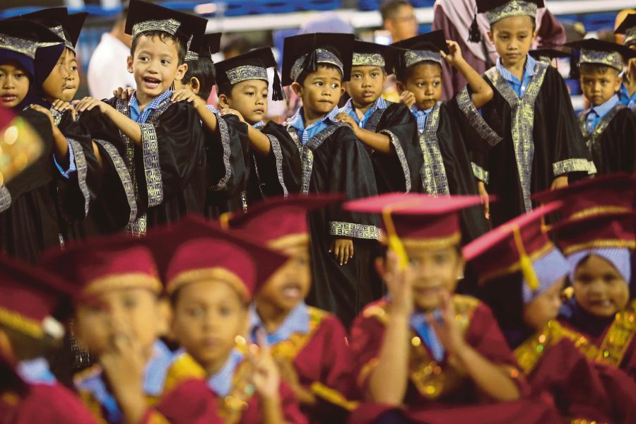 Preschoolers at their graduation. Educators can help pupils attending school for the first time find their roles in the world. FILE PIC