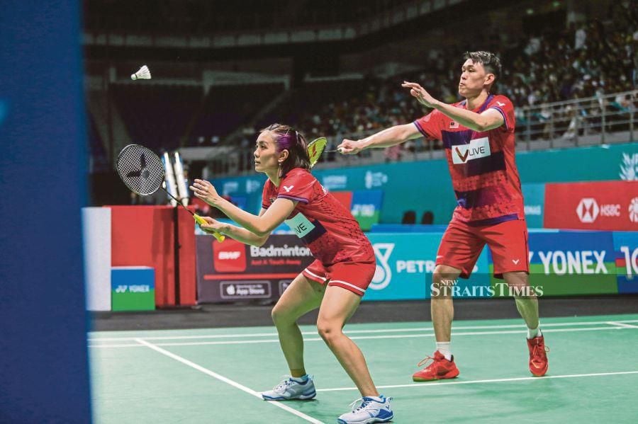 Pei Jing and her partner Tan Kian Meng narrowly avoided defeat at the Indonesia Open today, saving two match points in the second game to secure a remarkable 15-21, 23-21, 21-14 victory against Denmark's Mathias Christiansen-Alexandra Boje. NSTP/ASWADI ALIAS