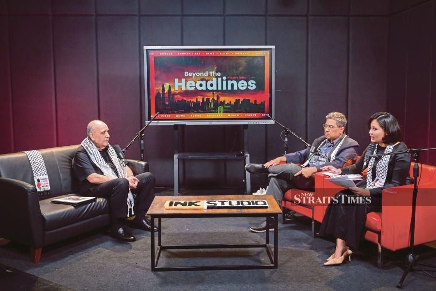 (From left) Palestinian ambassador to Malaysia Walid Abu Ali, New Straits Times’ op-ed editor Azman Abdul Hamid and NST assistant news editor Amalina Kamal speaking during a recording of the ‘Beyond The Headlines’ podcast in Balai Berita today. STU/RAIHANA MANSOR