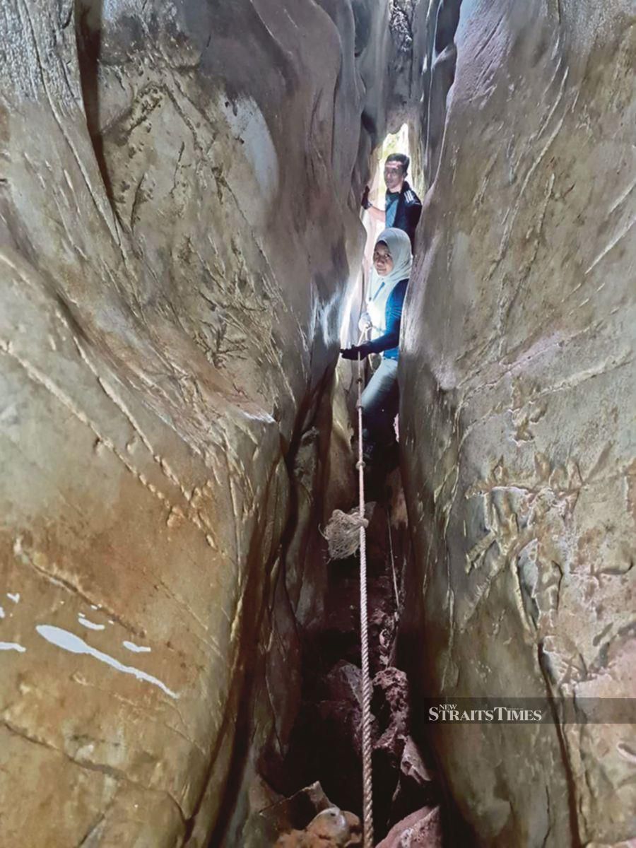 The narrow entrance into the cave of Bukit Gua Musang is no indication of how big the chamber is.