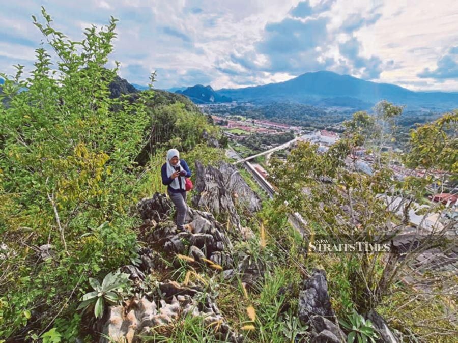The peak of Bukit Gua Musang holds a sweeping view of the old town of Gua Musang.