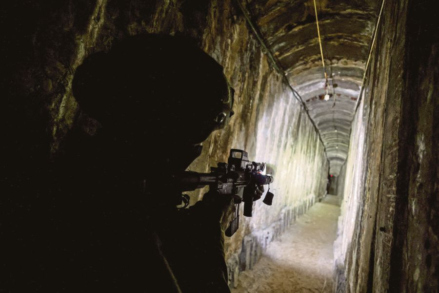 An Israeli soldier secures a tunnel underneath Al Shifa Hospital in Gaza City, amid the ongoing ground operation of the Israeli army against Palestinian fighter group Hamas, in the northern Gaza Strip. (REUTERS/Ronen Zvulun)