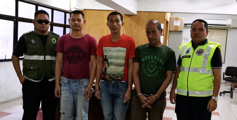 Filipinos (second from right) Abdul Rasah, Abdul Rahman Ebnul and Alkubar Hamjan sentence to 20, 14 and 12 months jail for possessing and selling green turtle eggs. Bernama Photo 