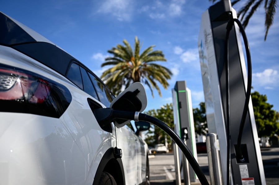The transition to EVs (Electric Vehicles) signifies a shift to clean energy vehicles, necessitating a robust EV infrastructure. One of the challenges in the adoption of EVs is the limited availability of charging stations. — AFP FILE PIC