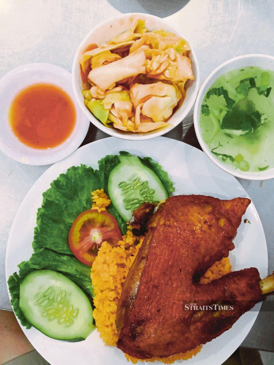 Tuck into a sumptuous chicken rice meal at A Hai restaurant.