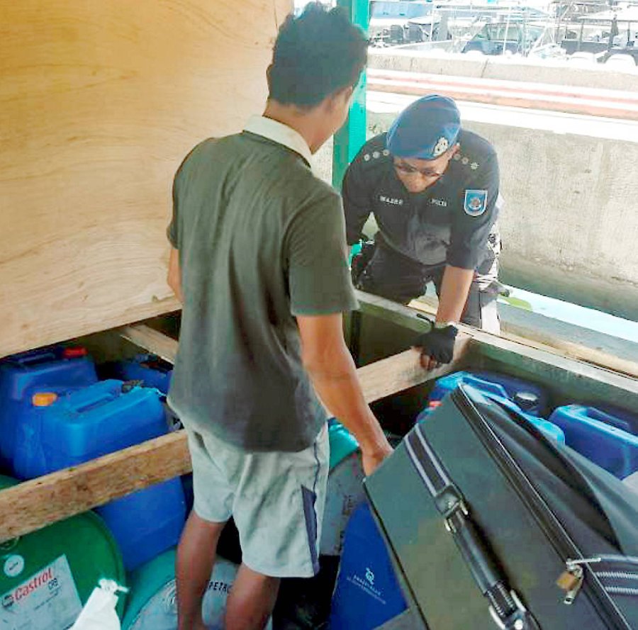 Marine personnel conducted a search on the boat and found the controlled items hidden in the storage compartment. Pix by Hazsyah Abdul Rahman
