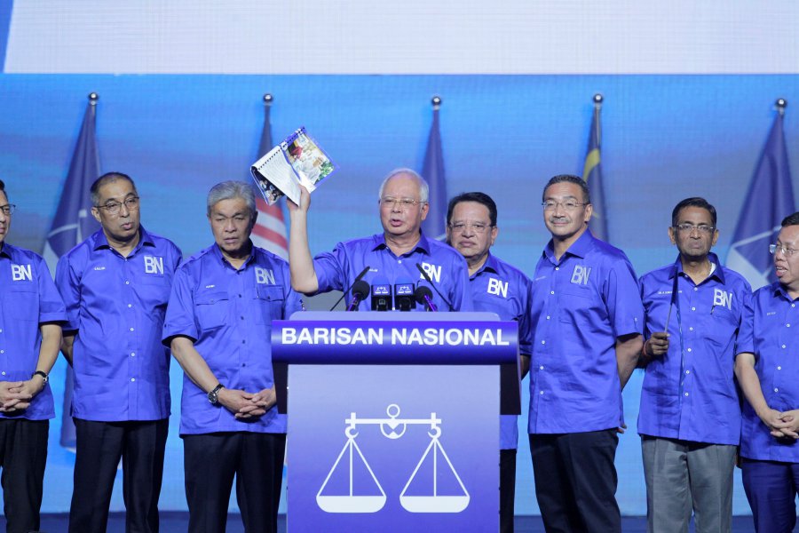 Barisan Nasional chairman Datuk Seri Najib Razak unveils the party’s 14th General Election manifesto at the Axiata Arena, Bukit Jalil. Pic by AIZUDDIN SAAD