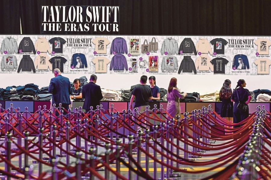 Workers prepare a store selling merchandise for US singer Taylor Swift at the Marina Bay Sands complex in Singapore on February 28, 2024, ahead of her sold-out shows in the city-state. AFP FILE PIC