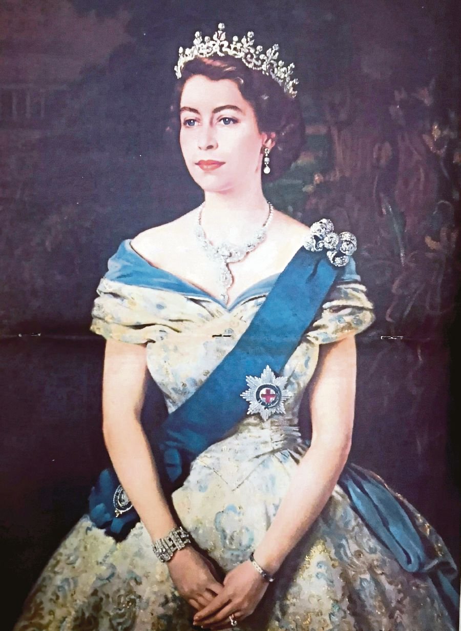 Each Straits Times’ Coronation Issue came with a copy of Queen Elizabeth II’s portrait by Welsh artist Margaret Lindsay Williams. PIX BY ALAN TEH LEAM SENG