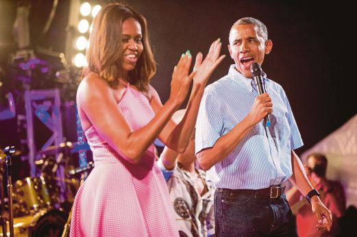 US President Barack Obama and his wife, First Lady Michelle Obama, celebrating Independence Day at the White House. Under Obama, the US stock market tripled, the number of uninsured halved, the banking system was saved and the country withdrew from two wars. 