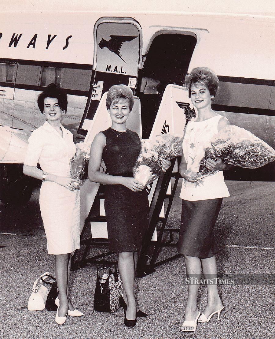 (From left) Beauty queens Josie Dwyer, Marilyn Tindall and Carolyn Joyner arriving at the Royal Malaysian Air Force base in Butterworth, Penang, from Sungai Besi Airport in Kuala Lumpur on a Malayan Airways plane on March 25, 1963. -Pic by Alan Teh Liam Seng