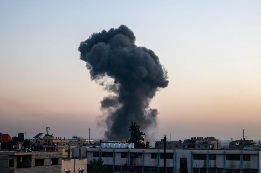 A billow of smoke rises over buildings after an Israeli strike in Rafah, southern Gaza Strip, on April 4, 2024, amid the ongoing conflict between Israel and Hamas. AFP FILE PIC.